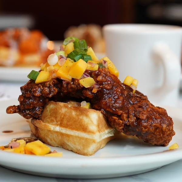 Bel Aire Diner's chicken and waffles, topped with mango salsa and green onions.